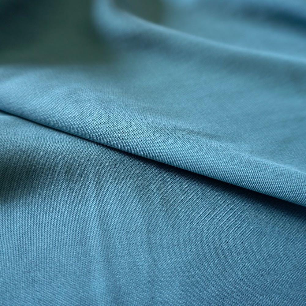 il_fullxfull.7946381759_m4d9.jpg Modal Woven Fabric – Teal blue - Image 1